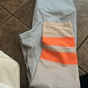 ALO Yoga Women's Leggings in Light Blue with Orange Stripes